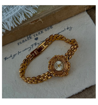 Elegant French-Inspired Golden Camellia Women's Quartz Watch - Boho Chic, Rhinestone Accents, Japanese Movement, Alloy Band - NEXTRENDBAHRAIN