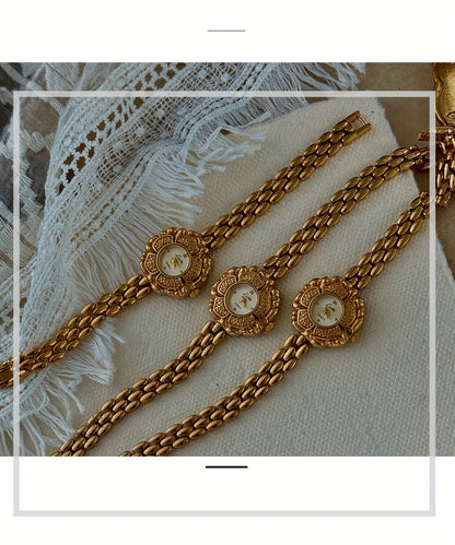 Elegant French-Inspired Golden Camellia Women's Quartz Watch - Boho Chic, Rhinestone Accents, Japanese Movement, Alloy Band - NEXTRENDBAHRAIN